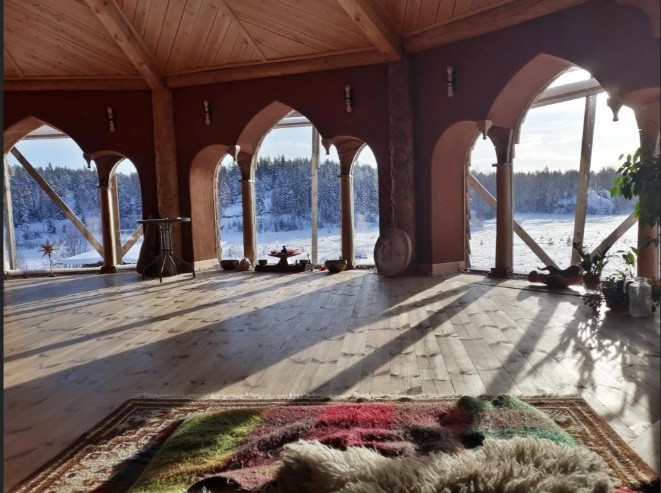 Dragon Temple interior — winter view through arched windows